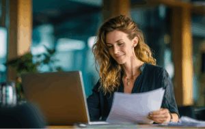 Business owner reviewing bridging loan documents for short-term cash flow solution