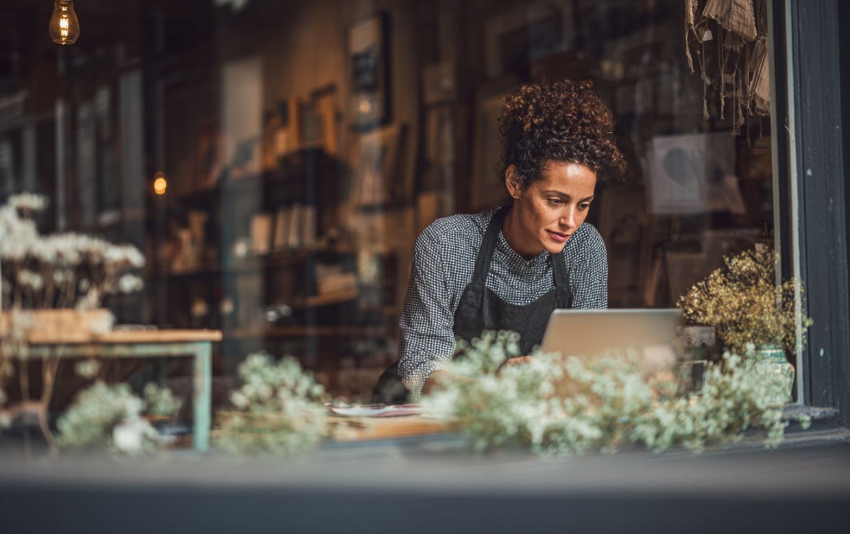 Seasonal business owner reviewing Q1 cash flow projections during winter slow season