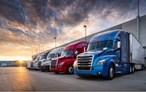 Modern semi-truck fleet parked at distribution center showing transportation business financing options
